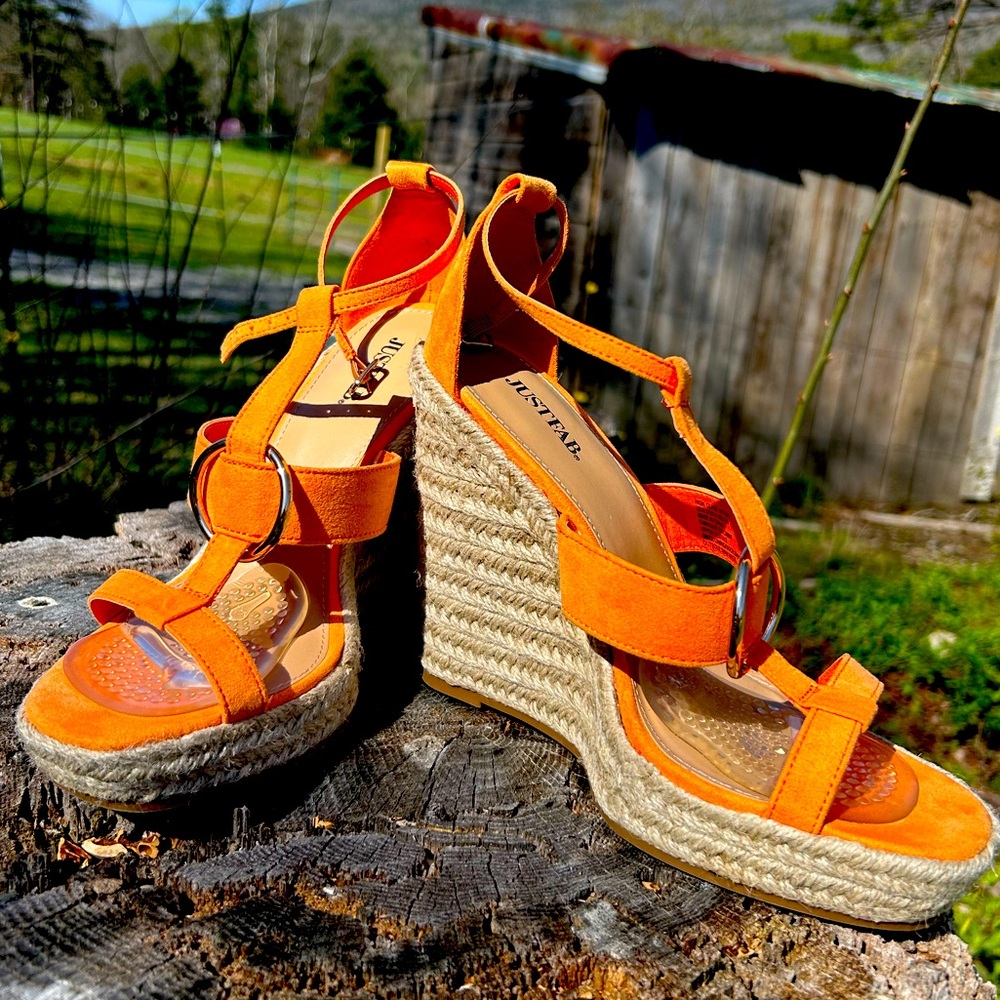 Orange high wedge heels with ankle straps. Worn only once. True to size.